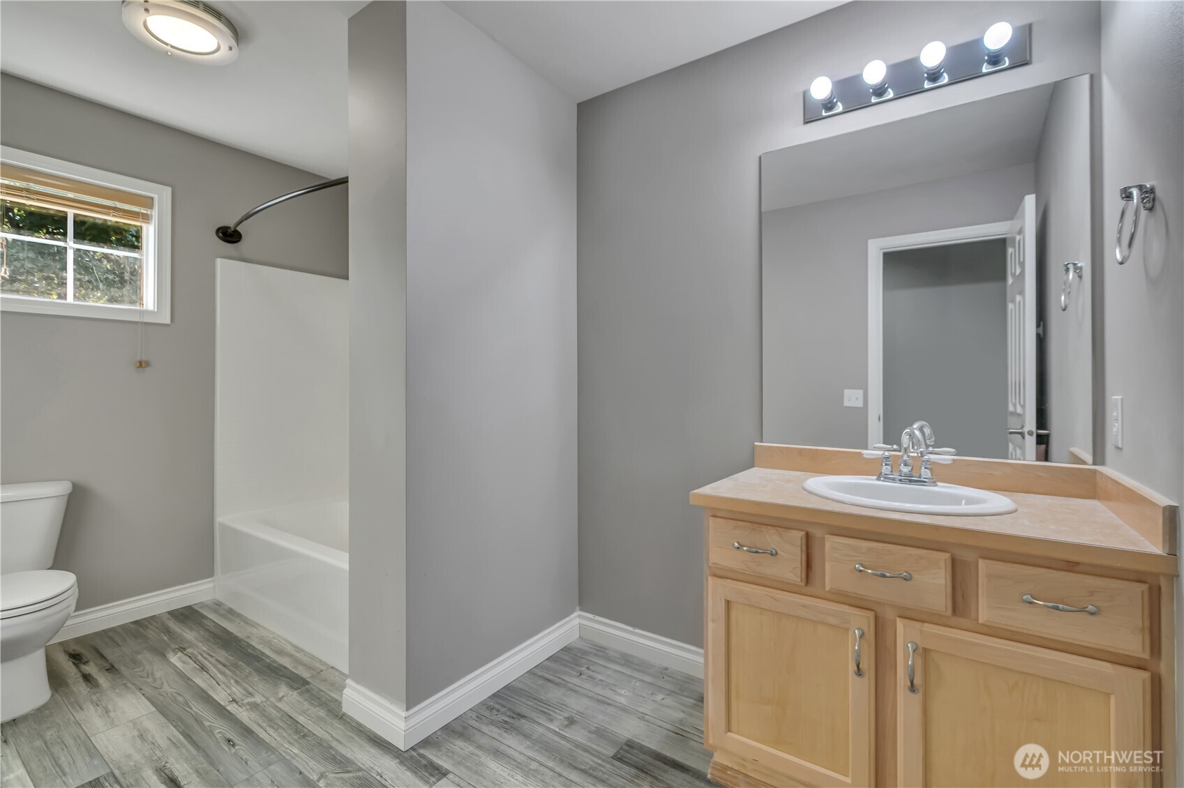 23516 Southeast 243rd Place Maple Valley, WA 98038 - Photo 25 of 31 a bathroom with a sink a toilet and a mirror