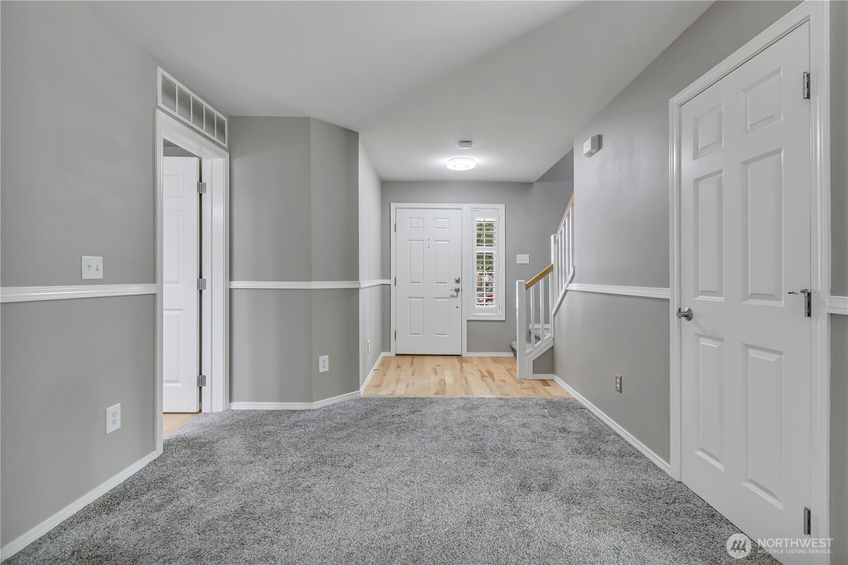 23516 Southeast 243rd Place Maple Valley, WA 98038 - Photo 4 of 33 a view of entryway with wooden floor and door