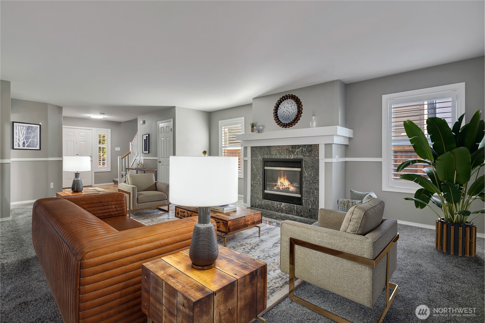 23516 Southeast 243rd Place Maple Valley, WA 98038 - Photo 5 of 31 a living room with furniture a fireplace and a potted plant