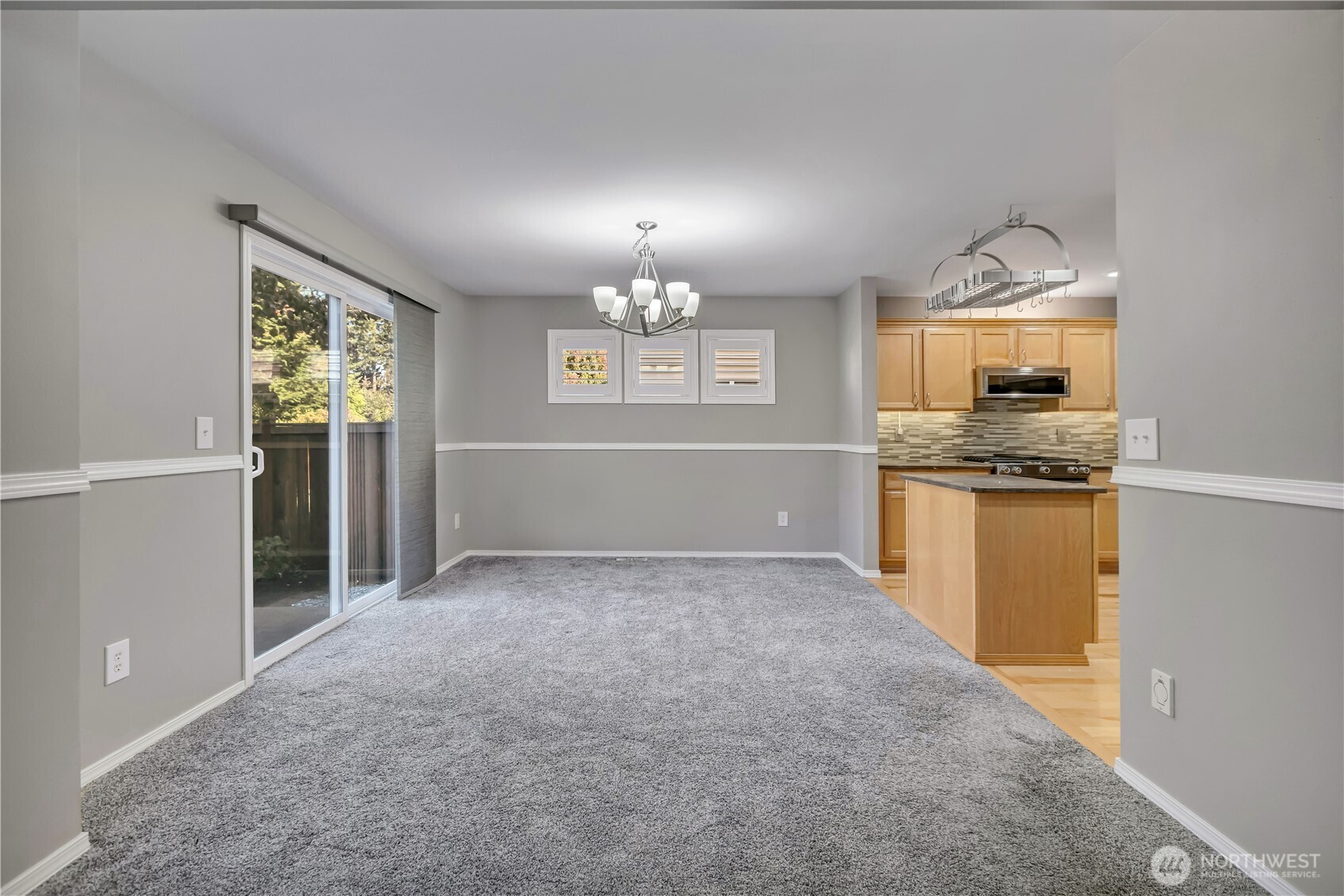 23516 Southeast 243rd Place Maple Valley, WA 98038 - Photo 8 of 33 an empty room with chandelier fan and windows