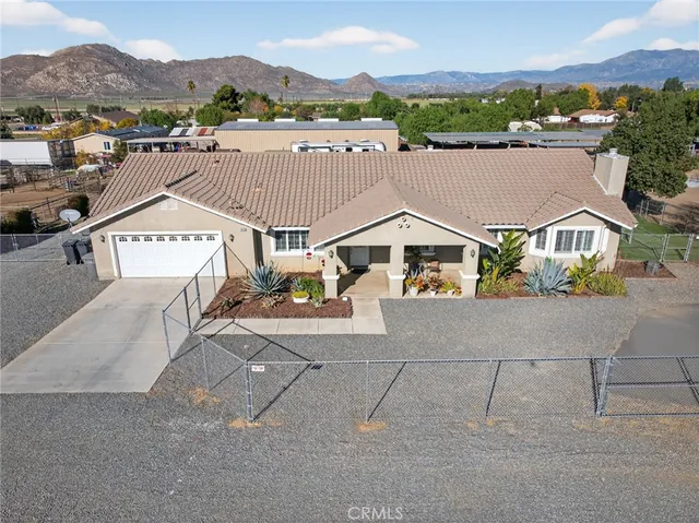 an aerial view of residential houses and outdoor space