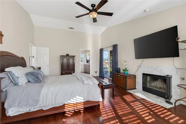 a bedroom with a bed and a fireplace