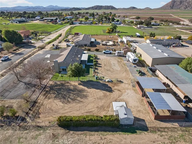 a view of a street with cars and parked cars