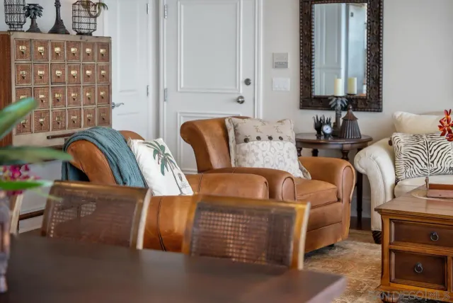 a living room with furniture and flowers