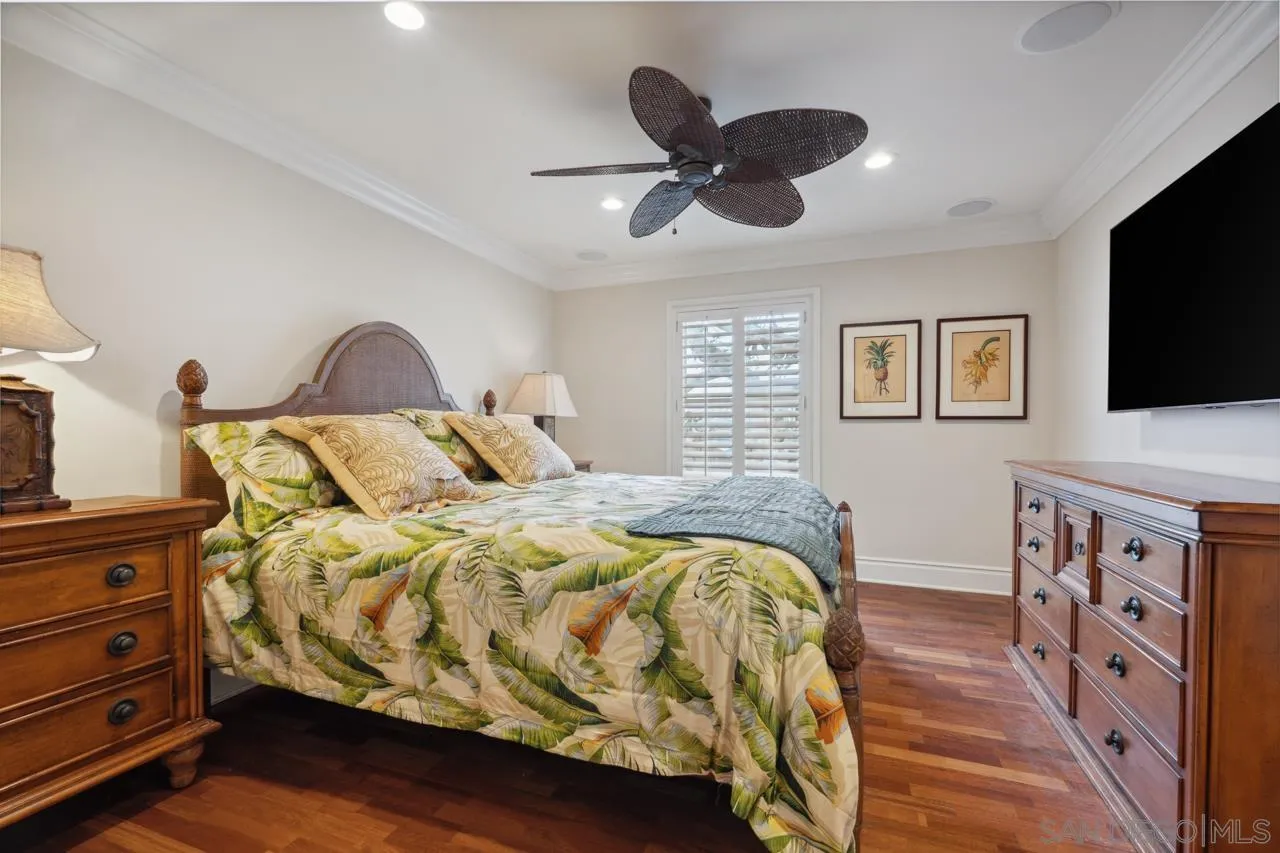 1219 Coast Boulevard, Unit 5 La Jolla, CA 92037 - Photo 21 of 31 a bedroom with a bed and a flat screen tv
