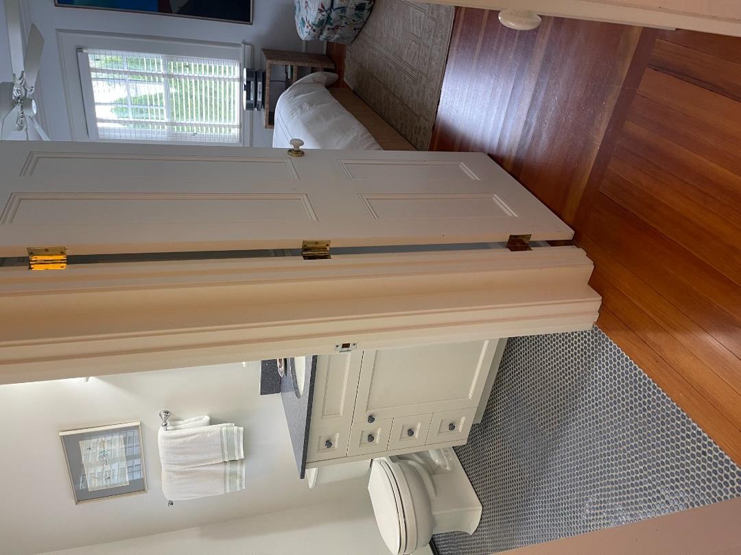 43 Cottage Street Edgartown, MA 02539 - Photo 16 of 24 a room with a bed and a window