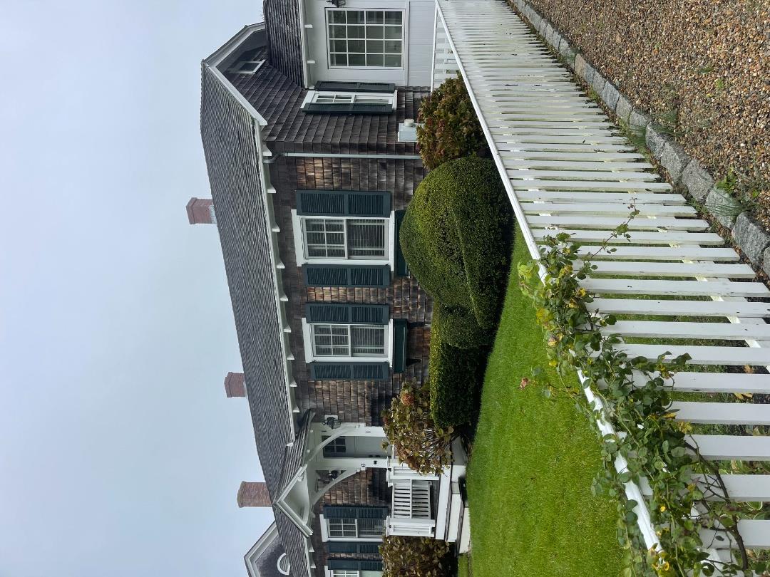 43 Cottage Street Edgartown, MA 02539 - Photo 2 of 24 a front view of a house with a yard