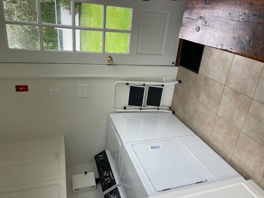 43 Cottage Street Edgartown, MA 02539 - Photo 21 of 24 a bedroom with a bed and a window