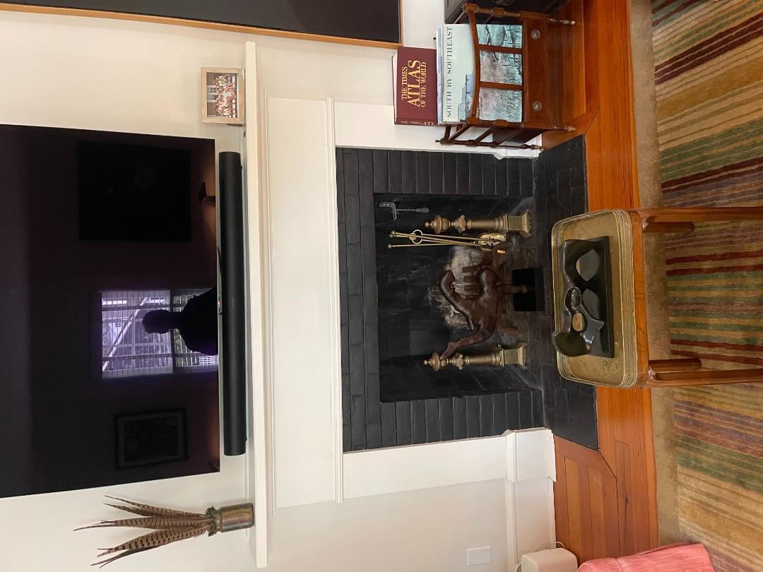 43 Cottage Street Edgartown, MA 02539 - Photo 9 of 24 a living room with furniture and a fireplace