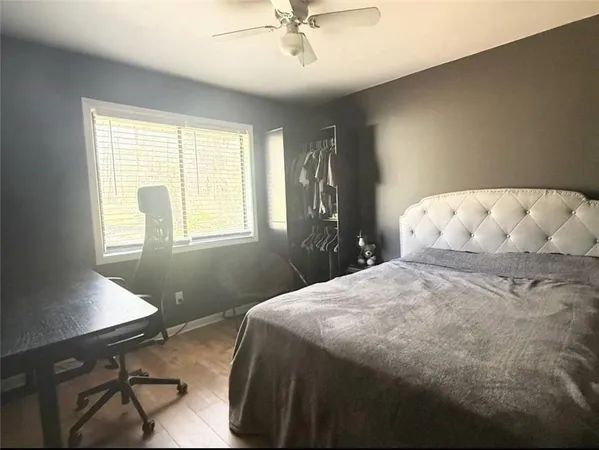 a view of a chairs and table on the wooden floor