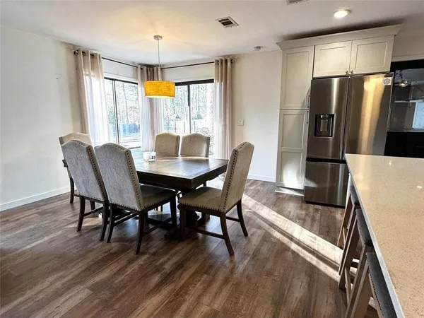a kitchen with stainless steel appliances a stove sink microwave and cabinets