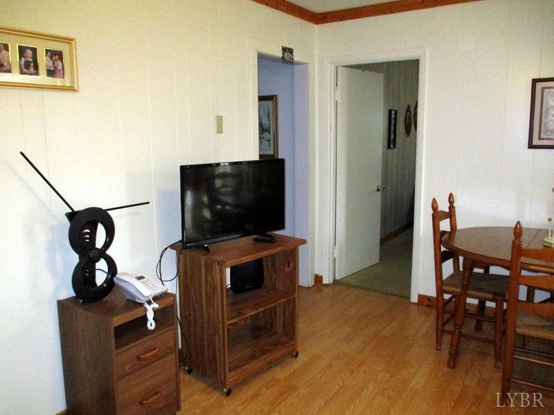 236 Jasper Wood Road Hurt, VA 24563 - Photo 6 of 28 a living room with furniture and a flat screen tv