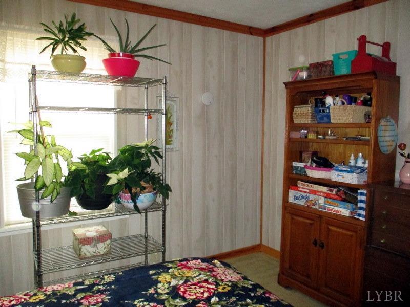236 Jasper Wood Road Hurt, VA 24563 - Photo 10 of 28 a table and a vase of flowers sitting on a table