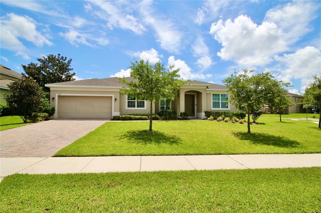 a front view of a house with a yard