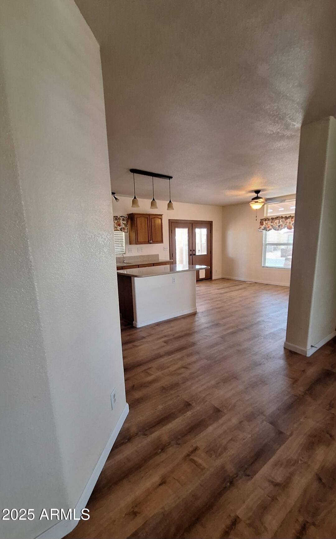 9351 East 28th Street East, Unit 212 Yuma, AZ 85365 - Photo 15 of 54 wooden floor in an empty room with a window