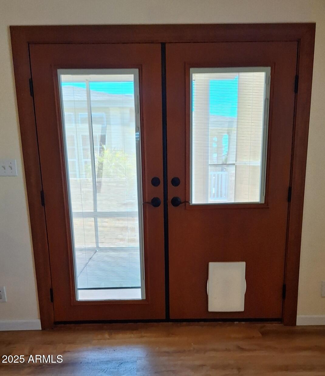 9351 East 28th Street East, Unit 212 Yuma, AZ 85365 - Photo 25 of 54 a view of an empty room with wooden floor and a window