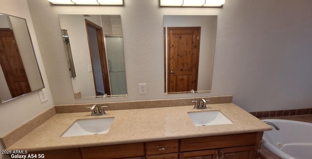 9351 East 28th Street East, Unit 212 Yuma, AZ 85365 - Photo 28 of 54 a bathroom with a sink and a mirror