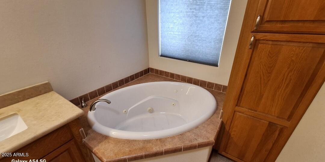 9351 East 28th Street East, Unit 212 Yuma, AZ 85365 - Photo 29 of 54 a bathroom with a sink and a mirror