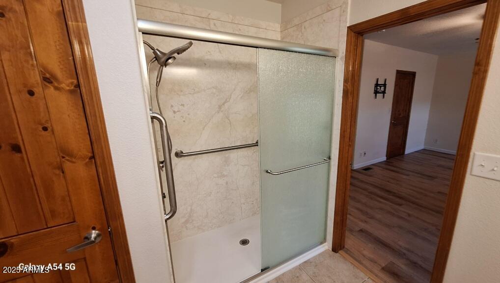9351 East 28th Street East, Unit 212 Yuma, AZ 85365 - Photo 30 of 54 a bathroom with a glass shower door and mirror