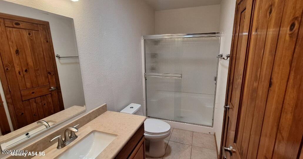 9351 East 28th Street East, Unit 212 Yuma, AZ 85365 - Photo 36 of 54 a bathroom with a granite countertop sink toilet and shower