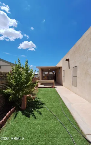 a terrace with outdoor seating and city view