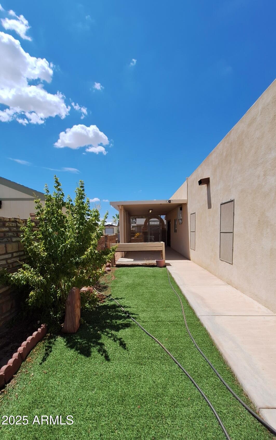 9351 East 28th Street East, Unit 212 Yuma, AZ 85365 - Photo 45 of 54 a view of a back yard of the house