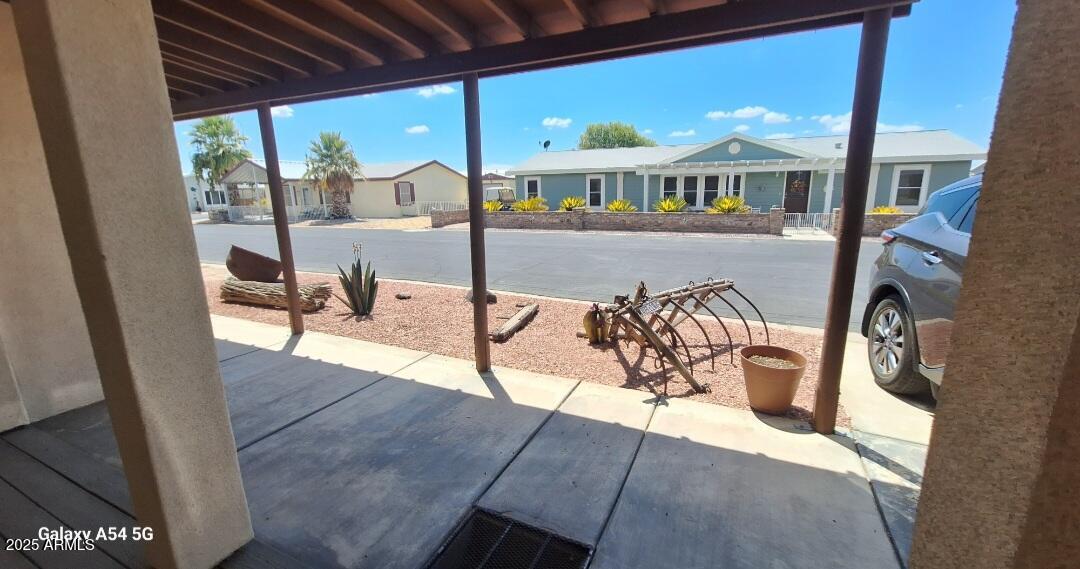 9351 East 28th Street East, Unit 212 Yuma, AZ 85365 - Photo 8 of 54 a view of a patio with swimming pool