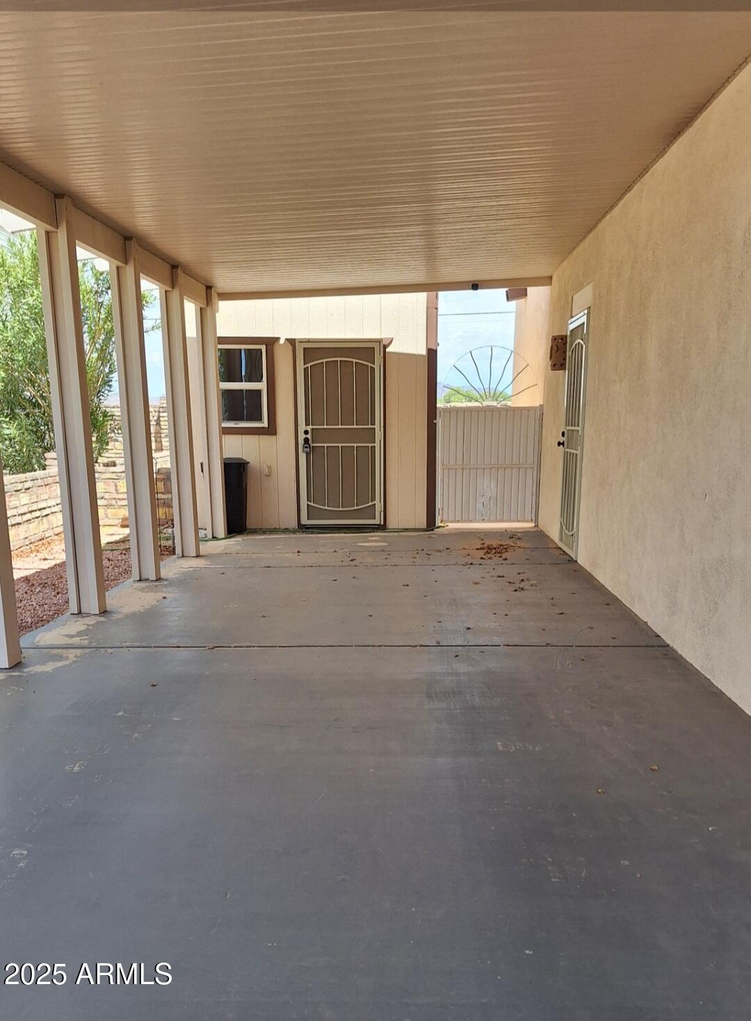 9351 East 28th Street East, Unit 212 Yuma, AZ 85365 - Photo 9 of 54 a view of an empty room with a window