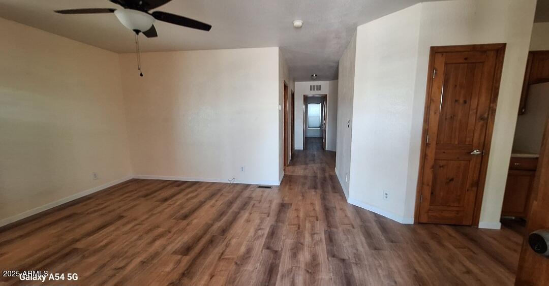 9351 East 28th Street East, Unit 212 Yuma, AZ 85365 - Photo 10 of 54 a view of hallway with wooden floor and ceiling fan