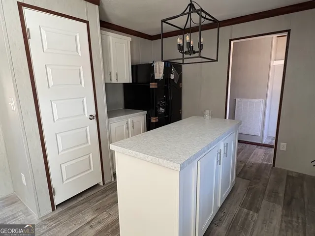 a kitchen with a refrigerator a sink and dishwasher