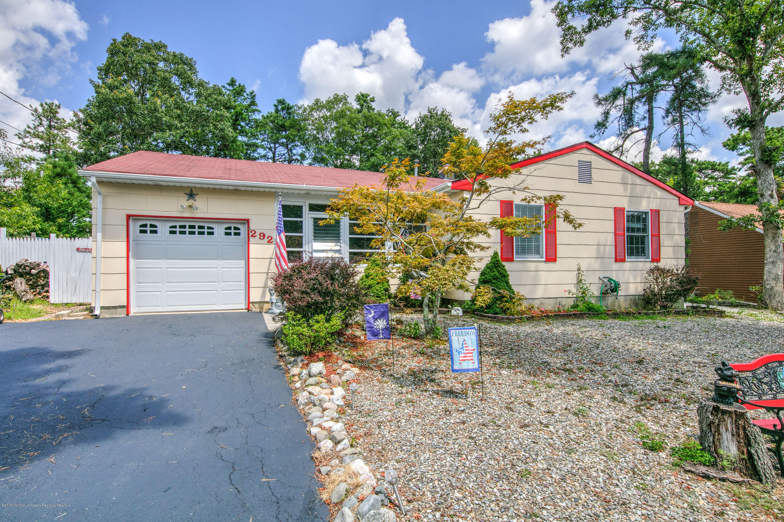 292 Compass Road Manahawkin, NJ 08050 - Photo 1 of 56 a house view with a garden space