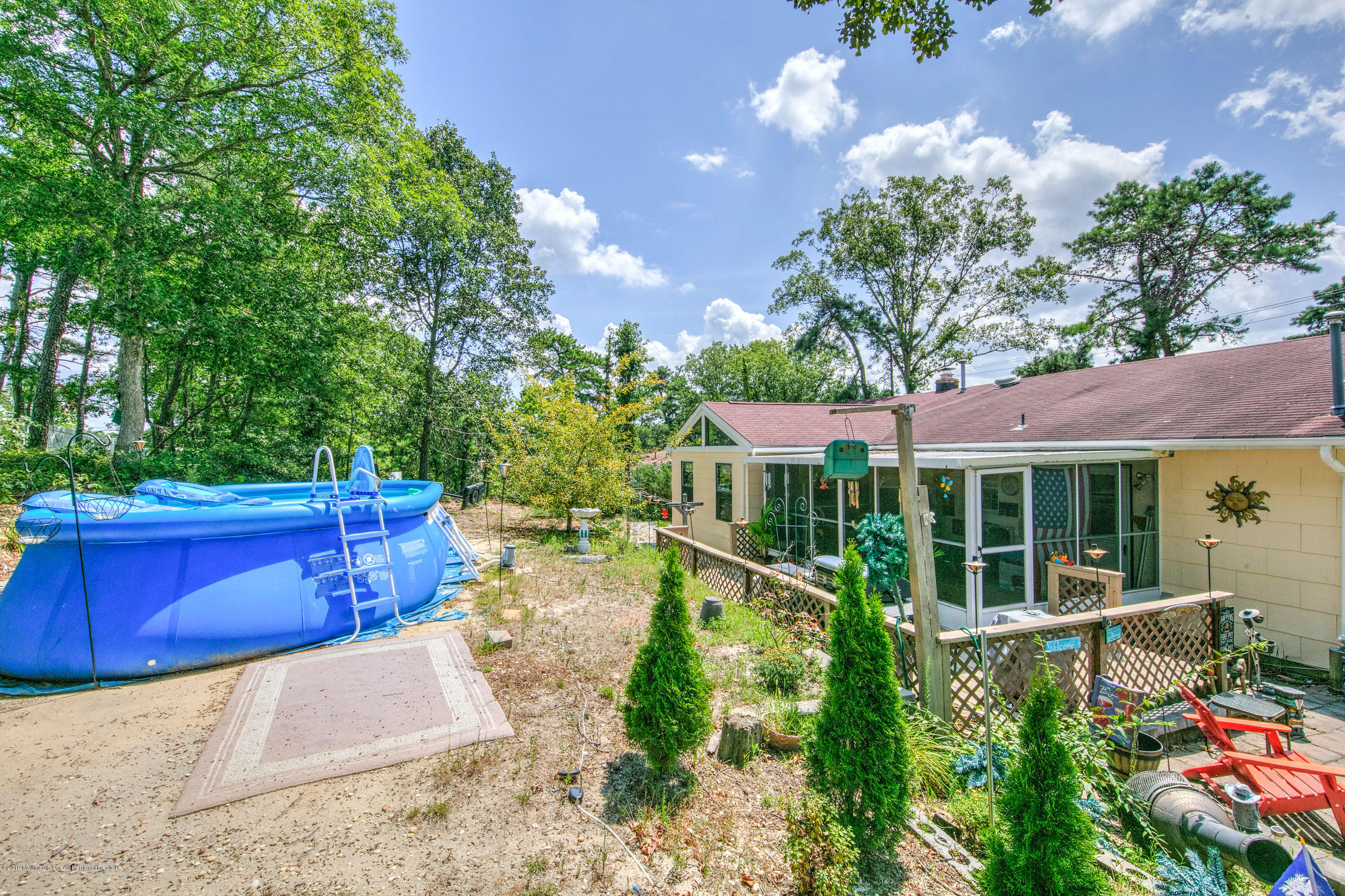 292 Compass Road Manahawkin, NJ 08050 - Photo 4 of 56 a view of a house with a yard and garden