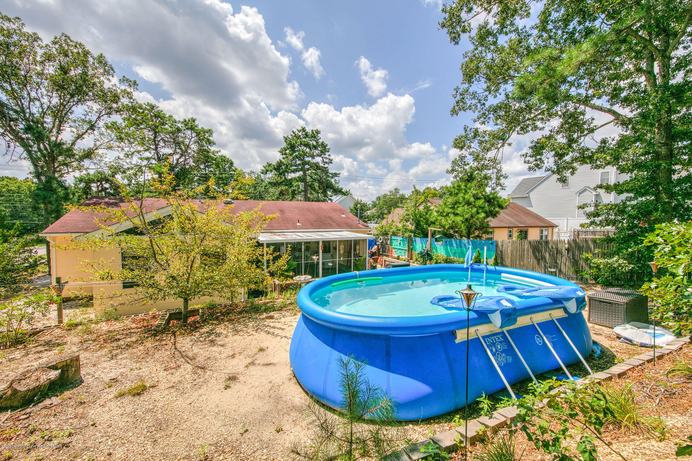 292 Compass Road Manahawkin, NJ 08050 - Photo 8 of 56 a view of a swimming pool with a patio