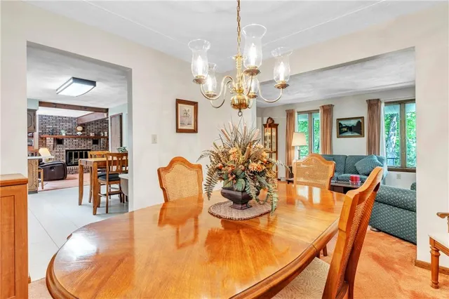 a dining room with furniture a livingroom and chandelier