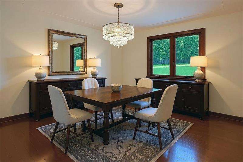 454 Cherokee Drive Butler, PA 16001 - Photo 17 of 29 a view of a dining room with furniture a chandelier and wooden floor