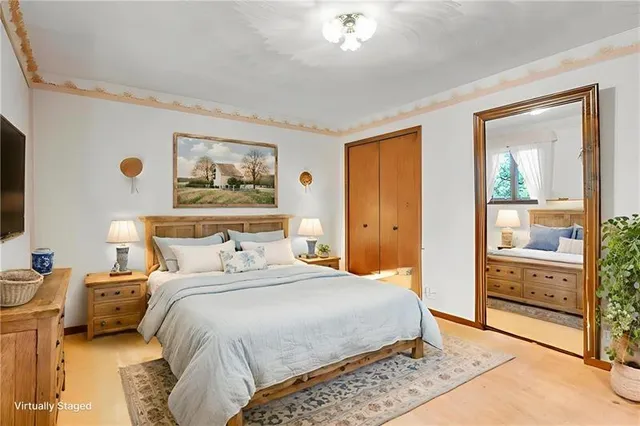 a bedroom with a bed and a cabinets