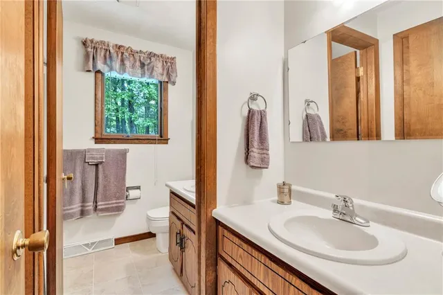 a en suite bathroom with a sink and a mirror