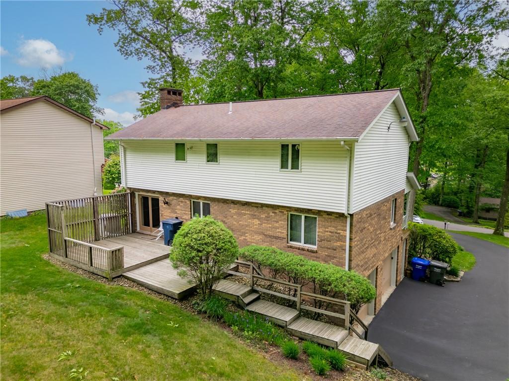 454 Cherokee Drive Butler, PA 16001 - Photo 6 of 29 a aerial view of a house with table and chairs under an umbrella