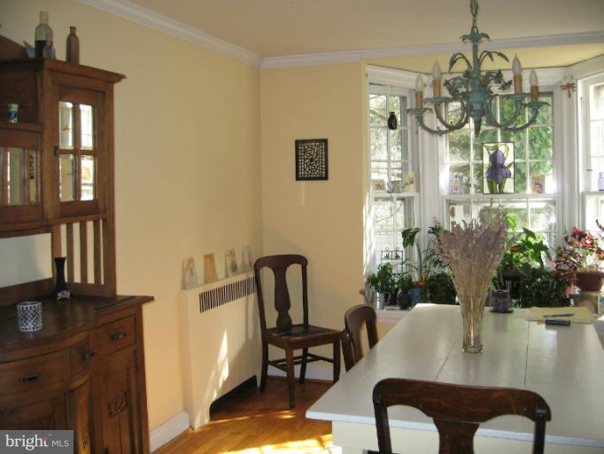 2447 Pickwick Road Baltimore, MD 21207 - Photo 3 of 28 a view of a dining room with furniture and a chandelier