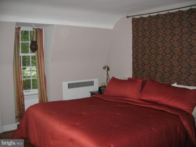 2447 Pickwick Road Baltimore, MD 21207 - Photo 23 of 28 a bedroom with a bed and a window