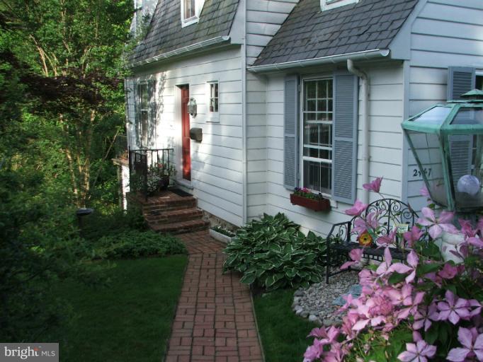 2447 Pickwick Road Baltimore, MD 21207 - Photo 7 of 28 a view of a house with potted plants