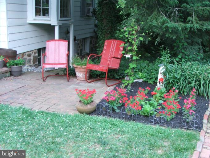 2447 Pickwick Road Baltimore, MD 21207 - Photo 8 of 28 a small garden covered with tall trees