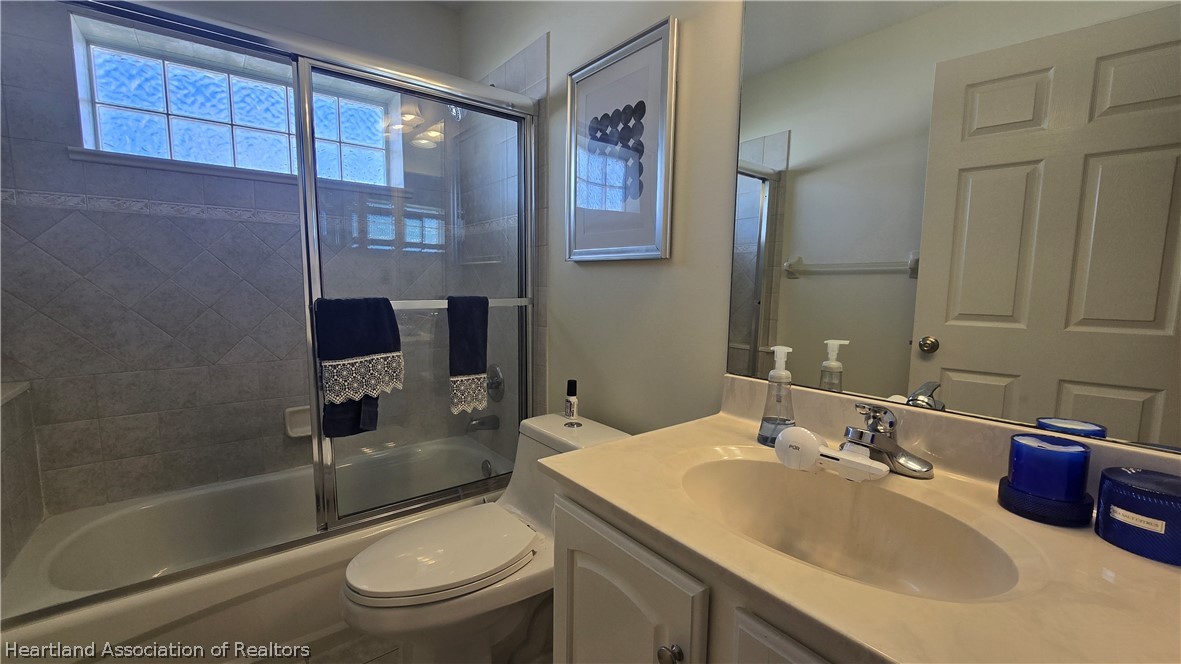 808 Spring Lake Boulevard Sebring, FL 33876 - Photo 24 of 38 a bathroom with a sink toilet and shower