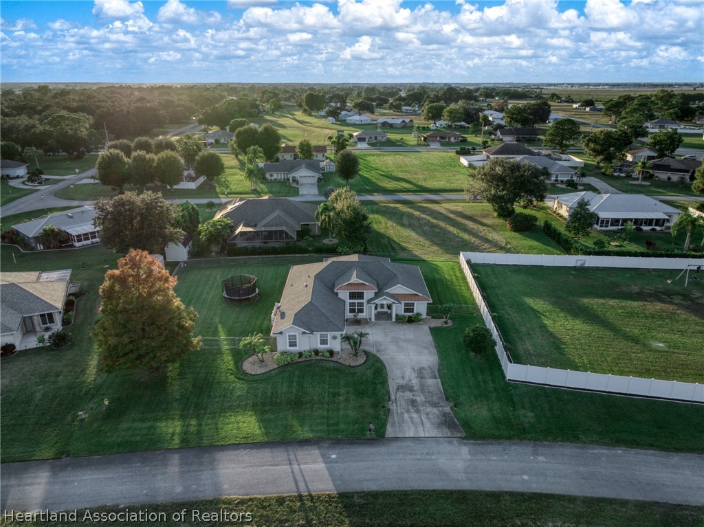 808 Spring Lake Boulevard Sebring, FL 33876 - Photo 31 of 38 an aerial view of a house with a yard