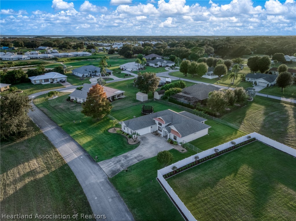 808 Spring Lake Boulevard Sebring, FL 33876 - Photo 32 of 38 an aerial view of a house with a yard and lake view