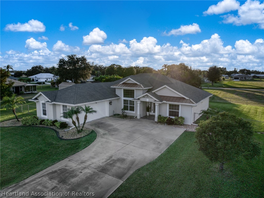 808 Spring Lake Boulevard Sebring, FL 33876 - Photo 37 of 38 a view of a house with a big yard