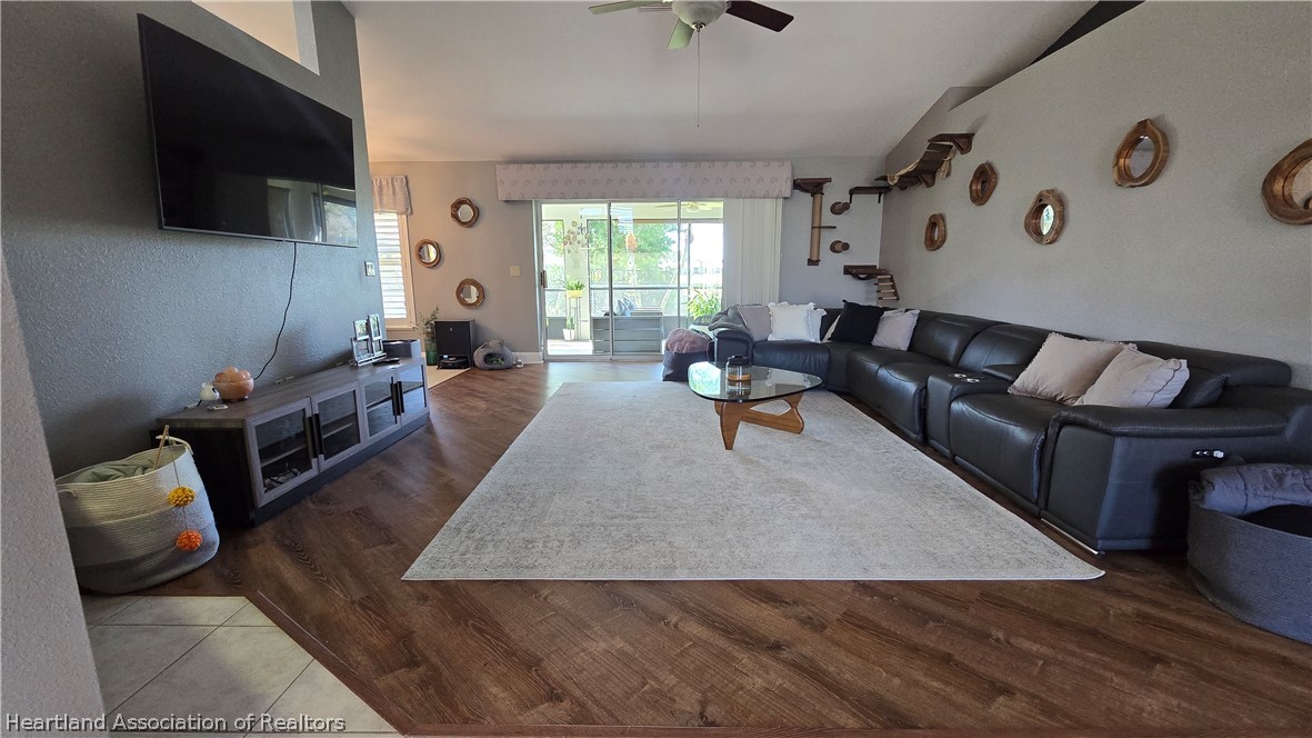 808 Spring Lake Boulevard Sebring, FL 33876 - Photo 5 of 38 a living room with furniture and a flat screen tv