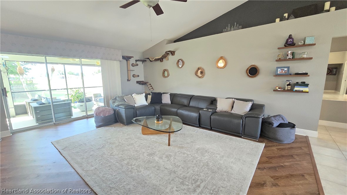 808 Spring Lake Boulevard Sebring, FL 33876 - Photo 6 of 38 a living room with furniture and a large window