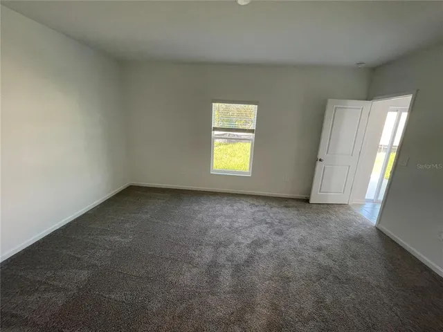 wooden floor and window in an empty room