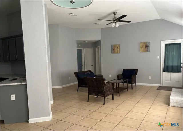 a work room with furniture and a window